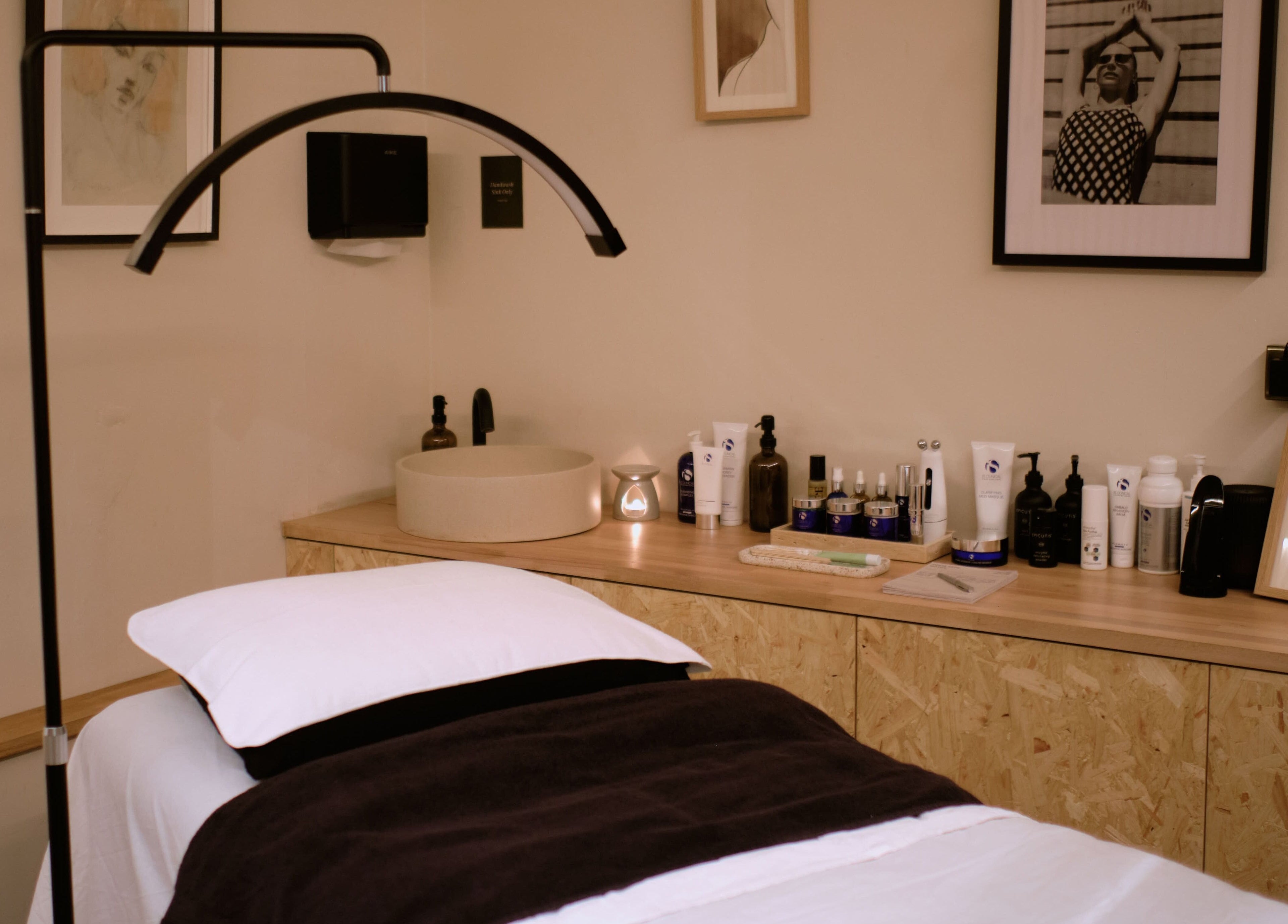 Treatment room at Cleo Rogers Skincare - SHY Studios, featuring cozy bed and skincare products in Lewes, England, GB.