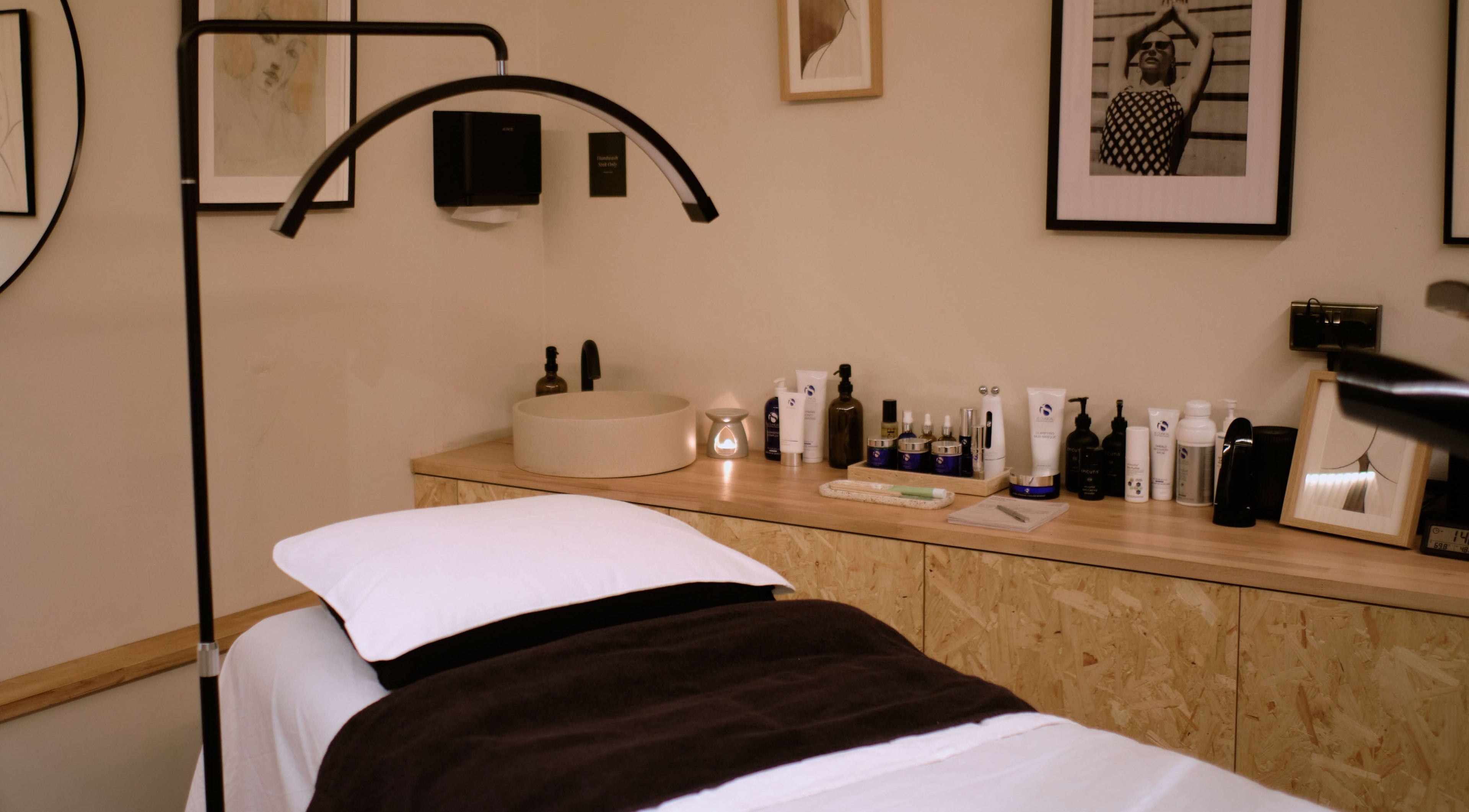 Treatment room at Cleo Rogers Skincare - SHY Studios, featuring cozy bed and skincare products in Lewes, England, GB.
