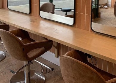 Elegant styling chairs and mirrors at Rockey's Hair Studio, Braunton, England, GB.