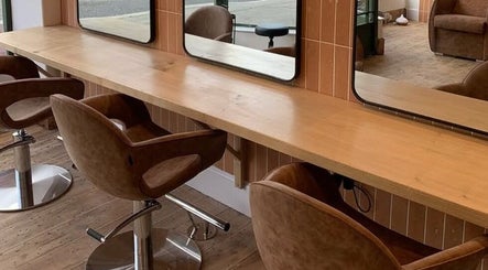 Elegant styling chairs and mirrors at Rockey's Hair Studio, Braunton, England, GB.