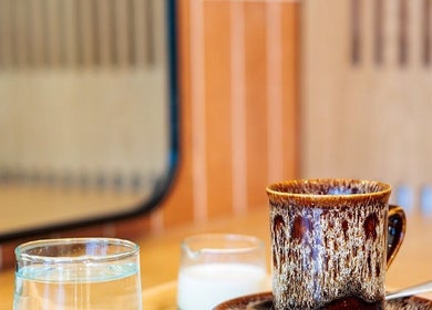 Cozy coffee setup at Rockey's Hair Studio, Braunton, England, GB, creating a relaxing salon experience.