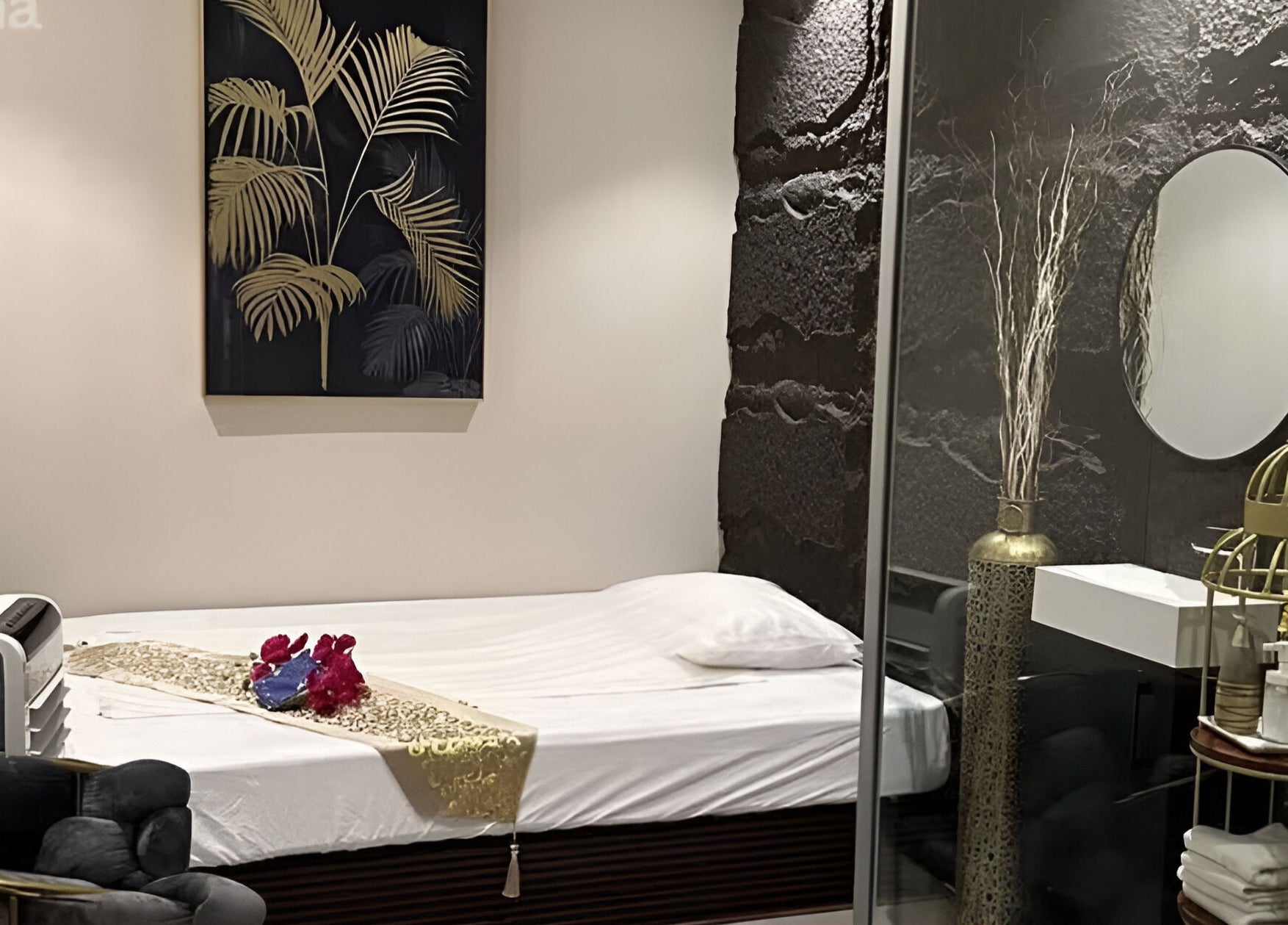 Elegant treatment room at Lotus Spa & Retreat in Dubai, Dubai, AE, featuring luxurious decor and a cozy bed.