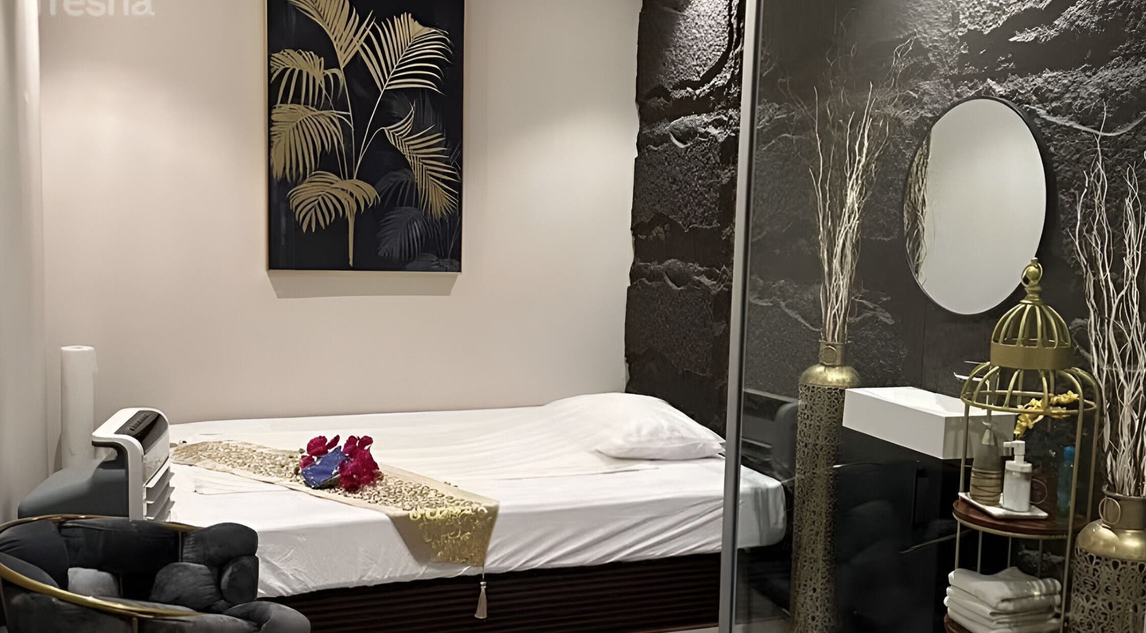 Elegant treatment room at Lotus Spa & Retreat in Dubai, Dubai, AE, featuring luxurious decor and a cozy bed.