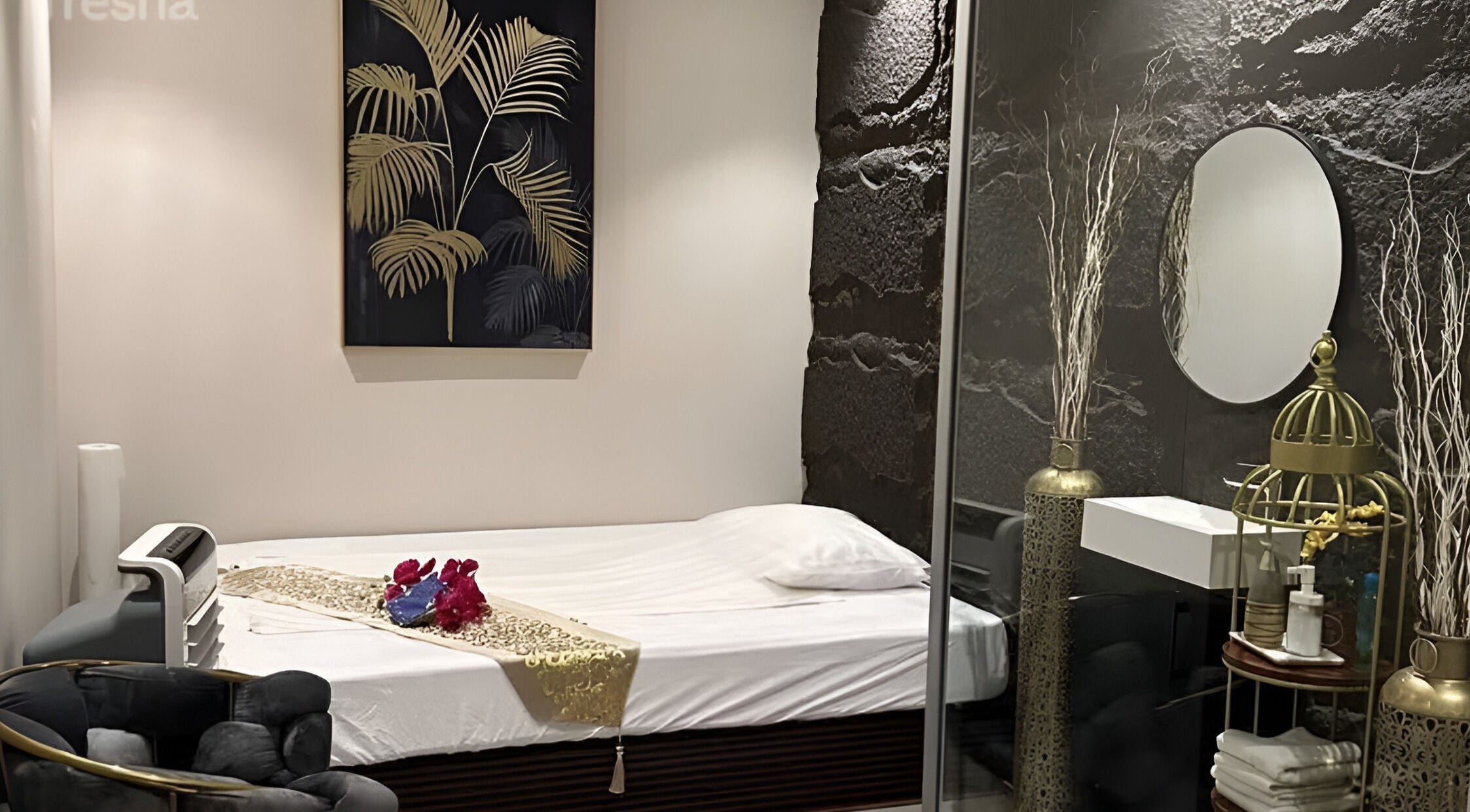 Elegant treatment room at Lotus Spa & Retreat in Dubai, Dubai, AE, featuring luxurious decor and a cozy bed.