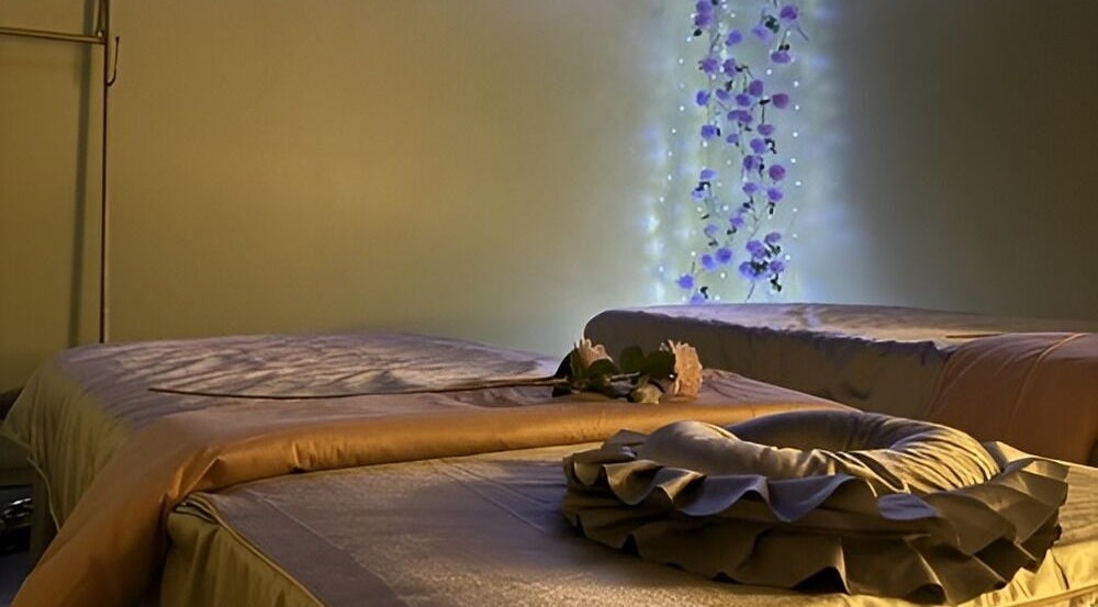 Luxurious massage beds at Peoples Wellness in New York, New York, US, enhanced with soothing floral lights.