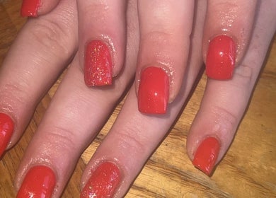 Vibrant red nails with a glossy finish at Blissful Touch Beauty By Michaela in Newry, Northern Ireland, GB.