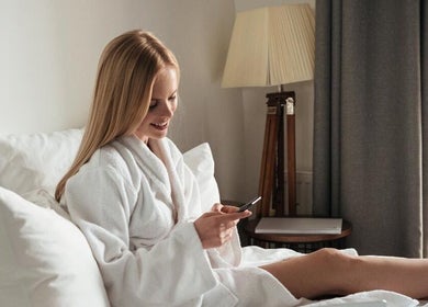 Woman relaxing in a robe at Get Me Pampered (Cardiff), Cardiff, GB, enjoying a peaceful moment.