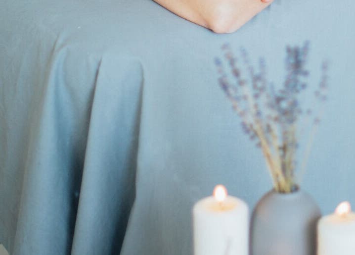 Calm massage setup with candles and lavender at Get Me Pampered, Chester, GB.