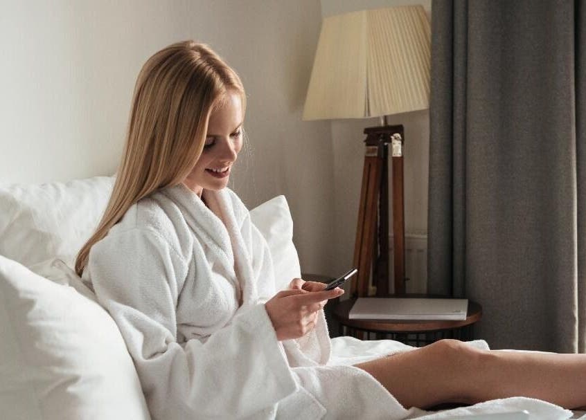 Woman in a bathrobe enjoying leisure at Get Me Pampered (Warrington), Warrington, GB spa suite.