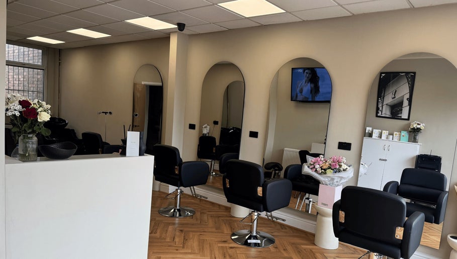 Elegant salon interior at STYLED | By Melissa, Reddish, England, GB with stylish chairs and mirrors.