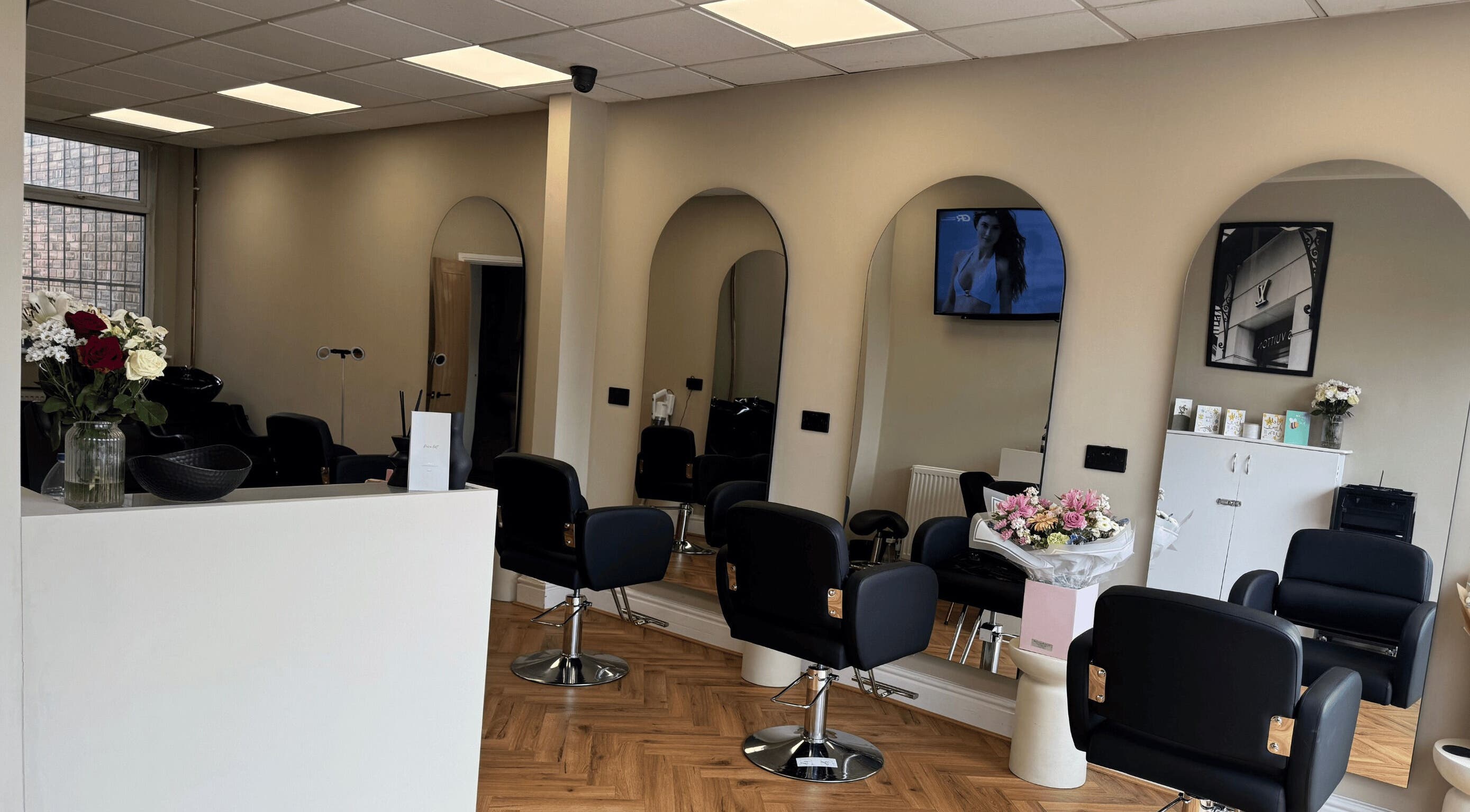 Elegant salon interior at STYLED | By Melissa, Reddish, England, GB with stylish chairs and mirrors.