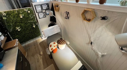 A serene treatment room at GlowLyssa Esthetics in Ada, Oklahoma, US, featuring a comfortable bed and nature decor.