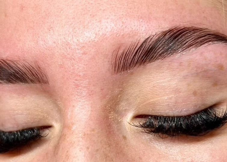 Close-up of beautifully sculpted brows and lashes at GlowLyssa Esthetics, Ada, Oklahoma, US.