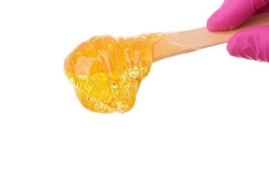 Close-up of sugaring paste application at Silk-E-Fyne in Winnipeg, Manitoba, CA for smooth skin results.