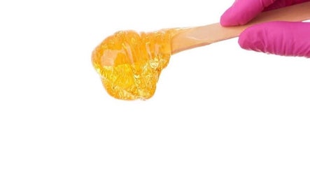 Close-up of sugaring paste application at Silk-E-Fyne in Winnipeg, Manitoba, CA for smooth skin results.