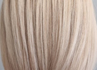 Close-up of sleek blonde hair at Anastasia, Taunton, England, GB, showcasing expert styling.