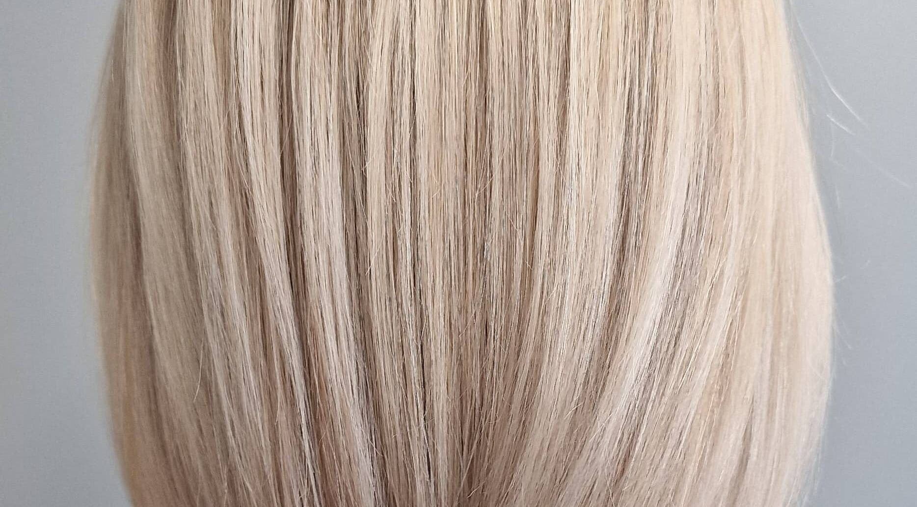Close-up of sleek blonde hair at Anastasia, Taunton, England, GB, showcasing expert styling.