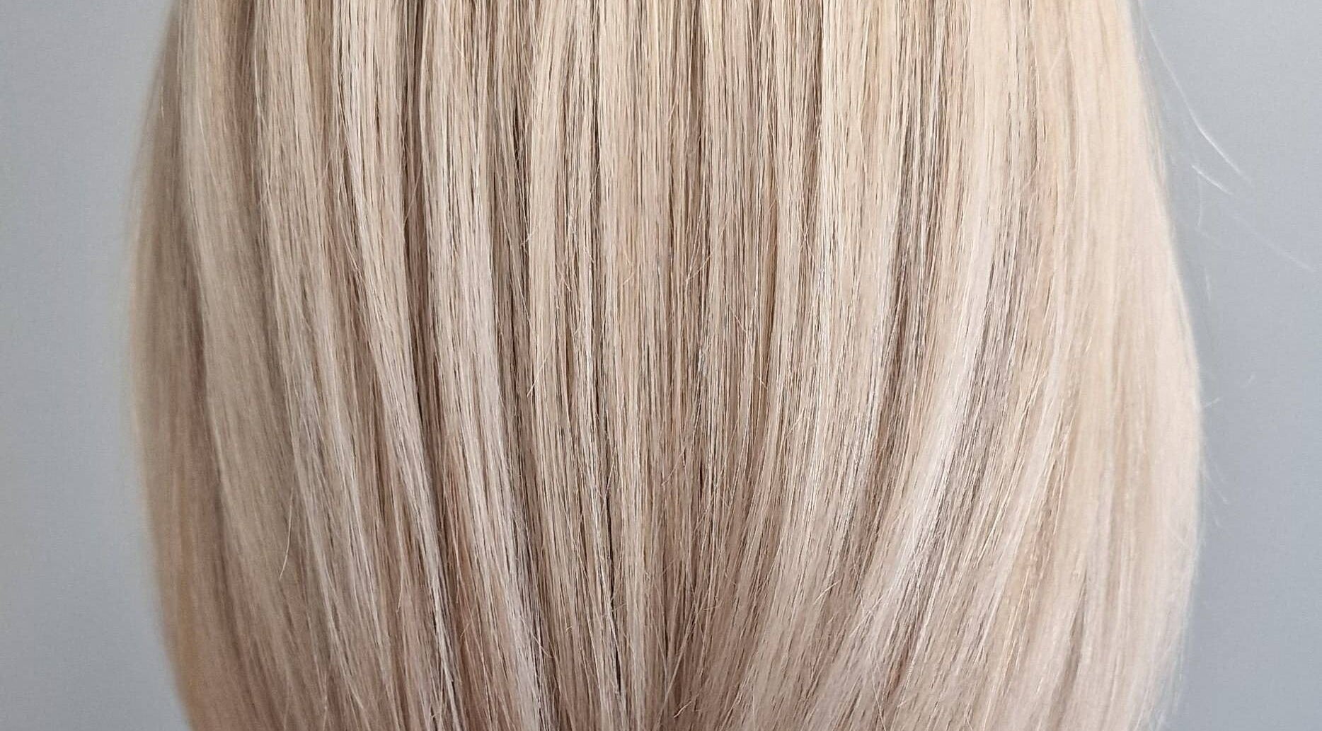 Close-up of sleek blonde hair at Anastasia, Taunton, England, GB, showcasing expert styling.