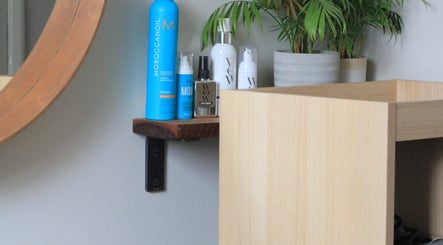 Beauty products on a wooden shelf at Anastasia, Taunton, England, GB, enhancing wellness experience.