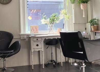 Stylish salon seating at Anastasia, Taunton, England. Modern decor and natural light enhance the elegance.