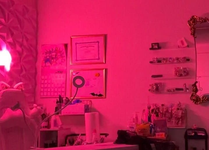 Chic interior of PEARADISE, Baltimore, Maryland, US, featuring vibrant red lighting and elegant decor.