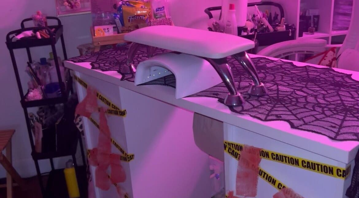 PEARADISE nail station, Baltimore, Maryland, US, adorned with purple lighting and Halloween decor.