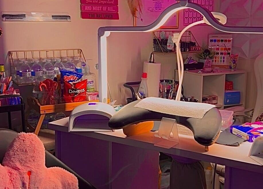 A cozy beauty station at Pearadise, Baltimore, Maryland, US, showcasing nail supplies and refreshments.