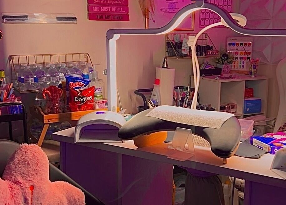 A cozy beauty station at Pearadise, Baltimore, Maryland, US, showcasing nail supplies and refreshments.