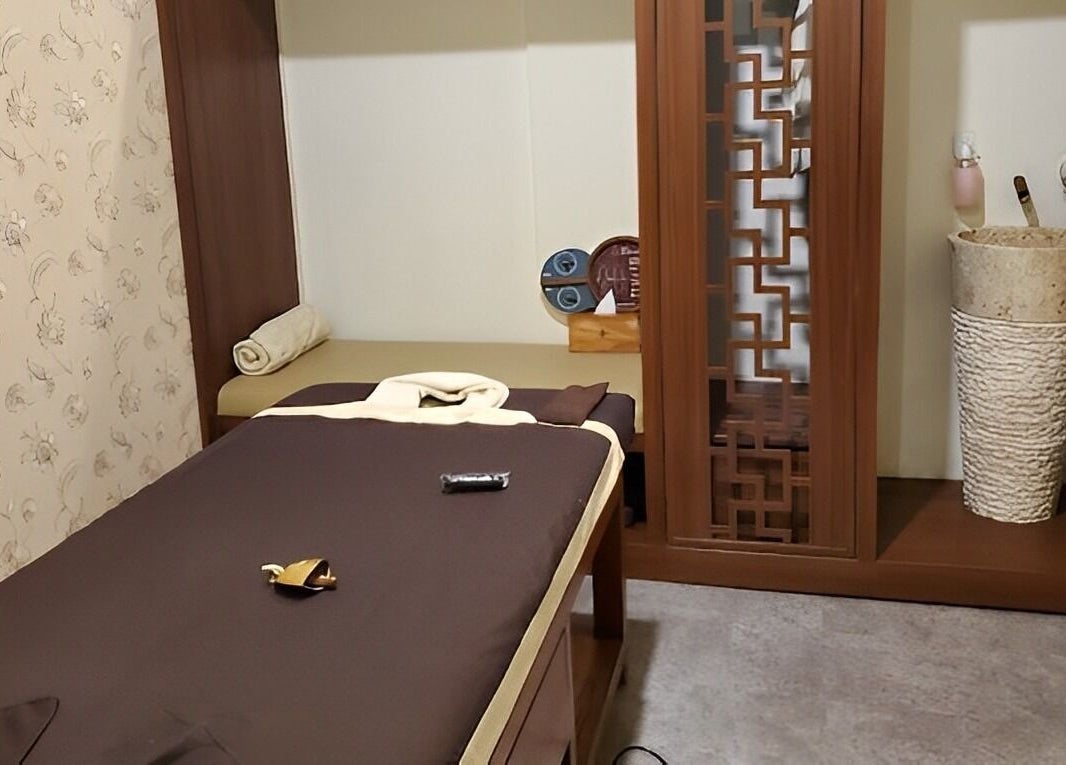 Cozy massage room at Spa Central Jogja, Daerah Istimewa Yogyakarta, Indonesia. Relaxing ambiance with warm tones.