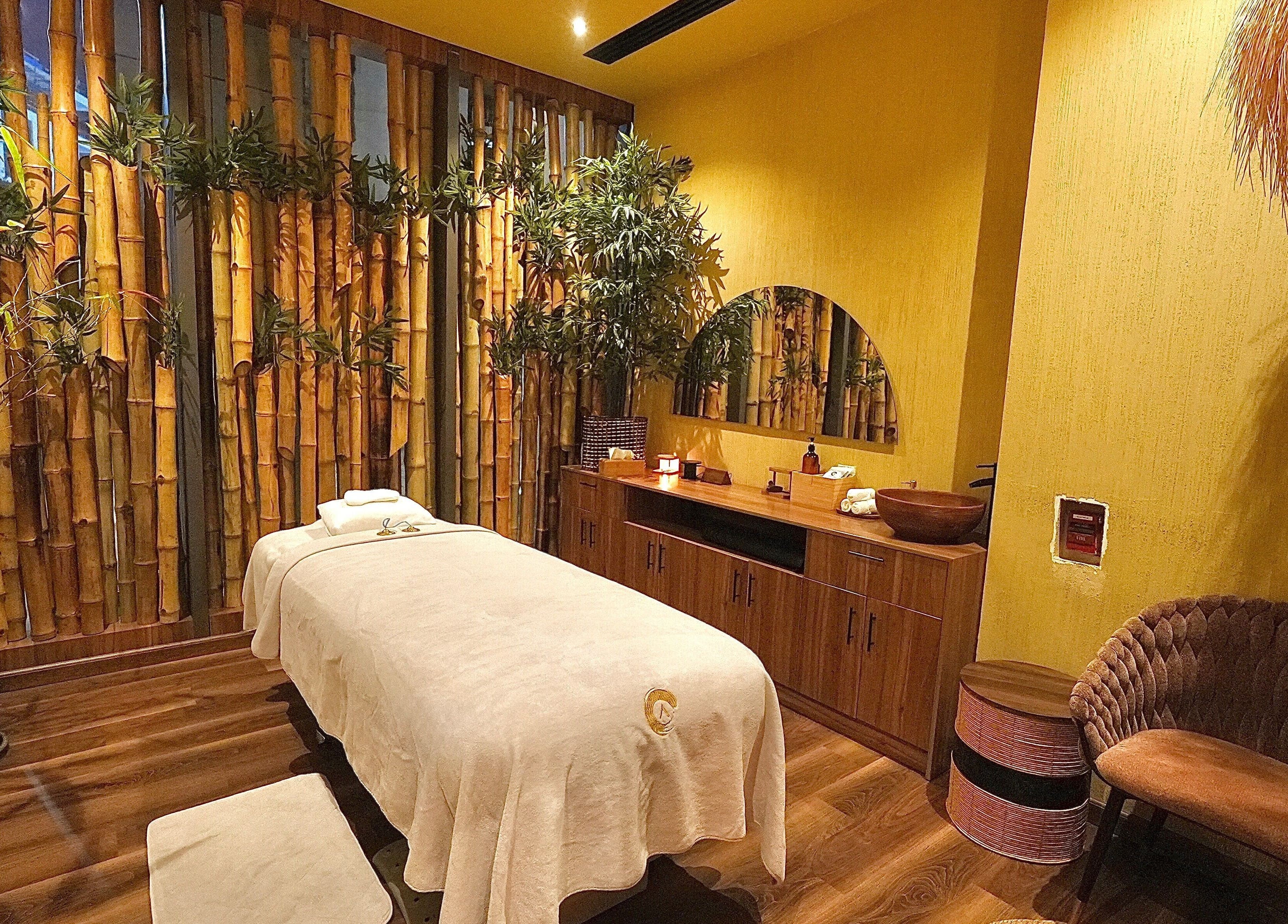 Serene bamboo-themed massage room at Adara Spa Retreat, Ladies Spa, Dubai, Dubai, AE, offers ultimate relaxation.