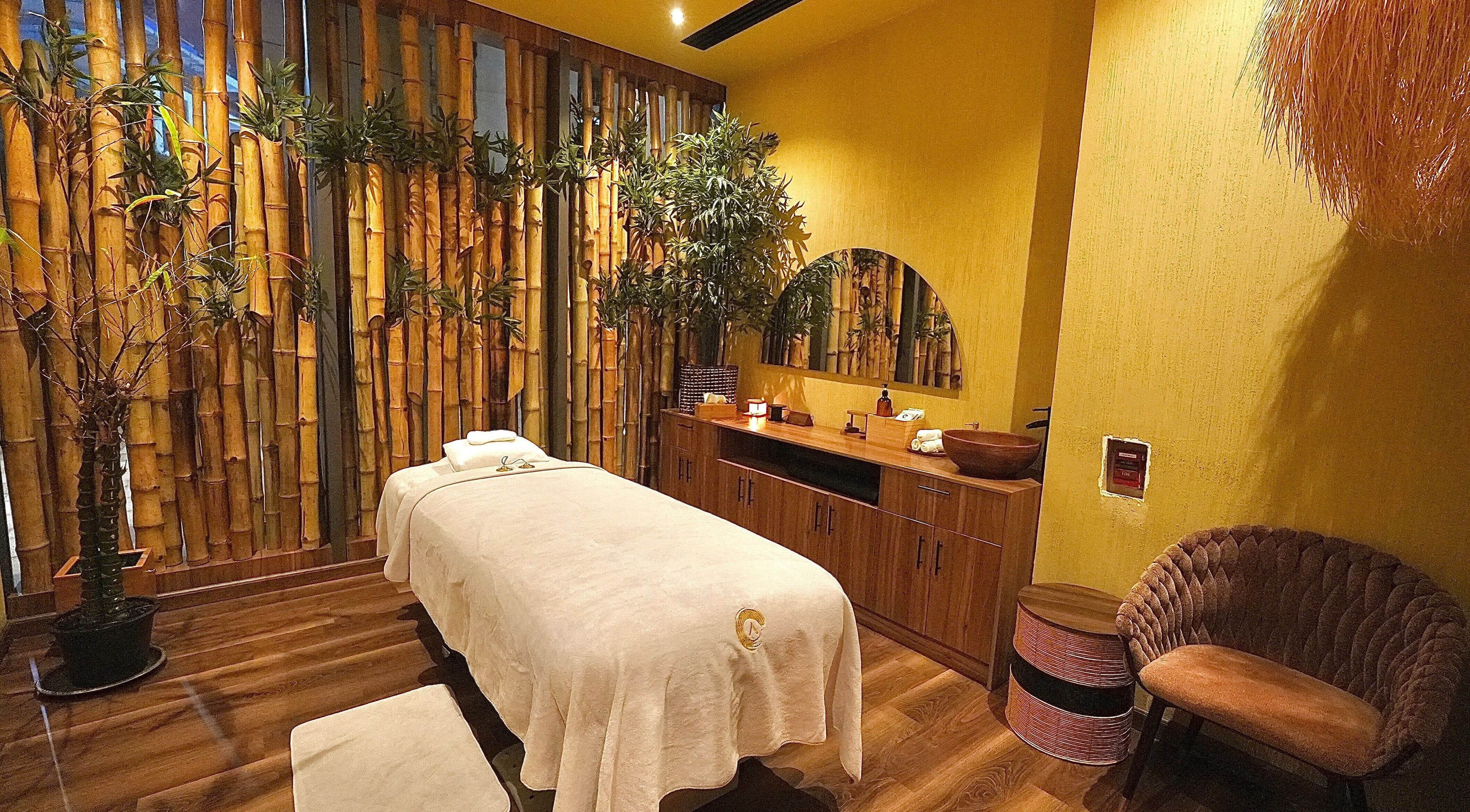 Serene bamboo-themed massage room at Adara Spa Retreat, Ladies Spa, Dubai, Dubai, AE, offers ultimate relaxation.