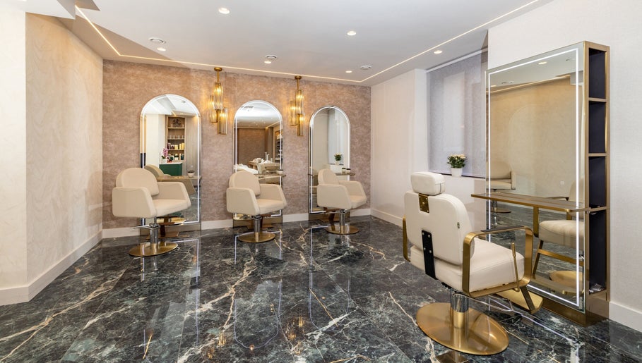 Modern salon chairs and mirrors at George Vallossian, London, England, GB, exuding luxury and style.