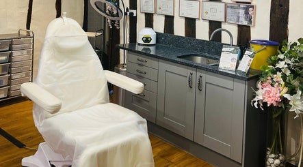 Cozy treatment room at Skin & Vain, Lawford, England, GB with sleek chair and elegant decor.