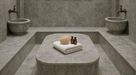 Luxurious spa room at Chemist Aesthetics Liverpool, featuring plush towels and elegant decor, Liverpool, England, GB.