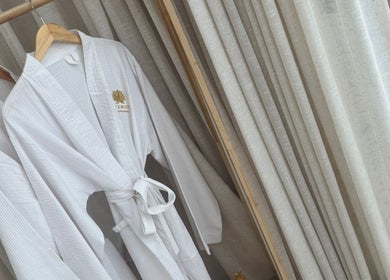 Elegant white robes at Chemist Aesthetics Liverpool, located in Liverpool, England, GB, showcasing spa luxury.