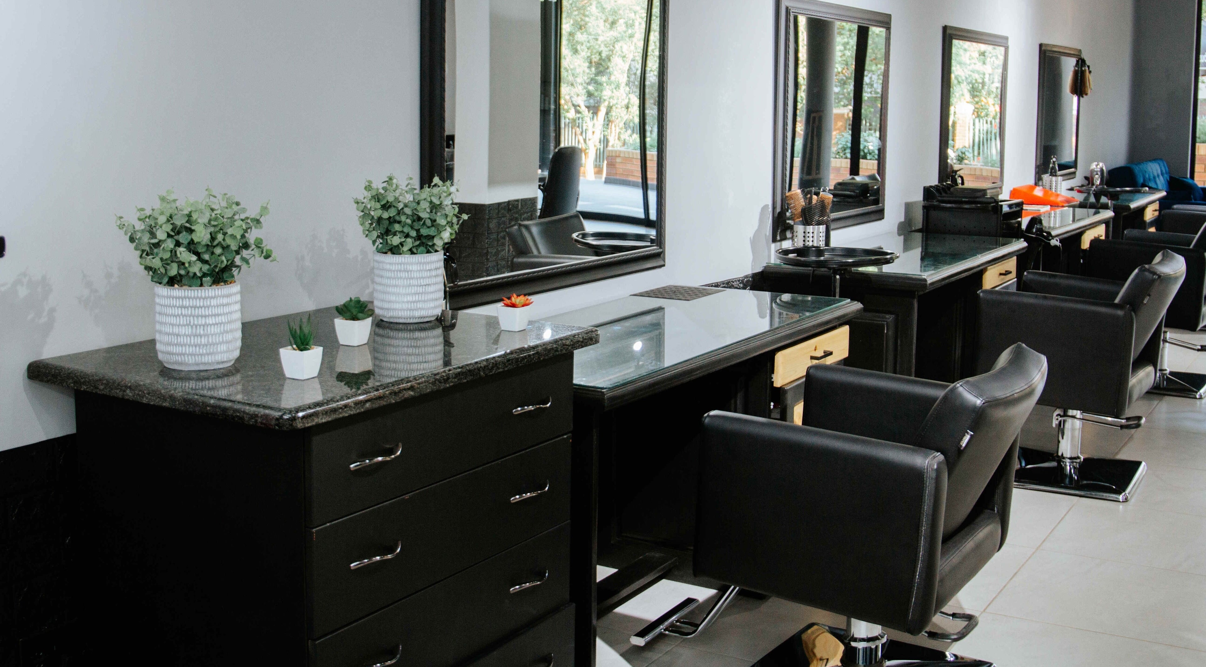 Interior of Identity Hair, Nails and Beauty in Pretoria, Gauteng, ZA featuring modern styling stations.
