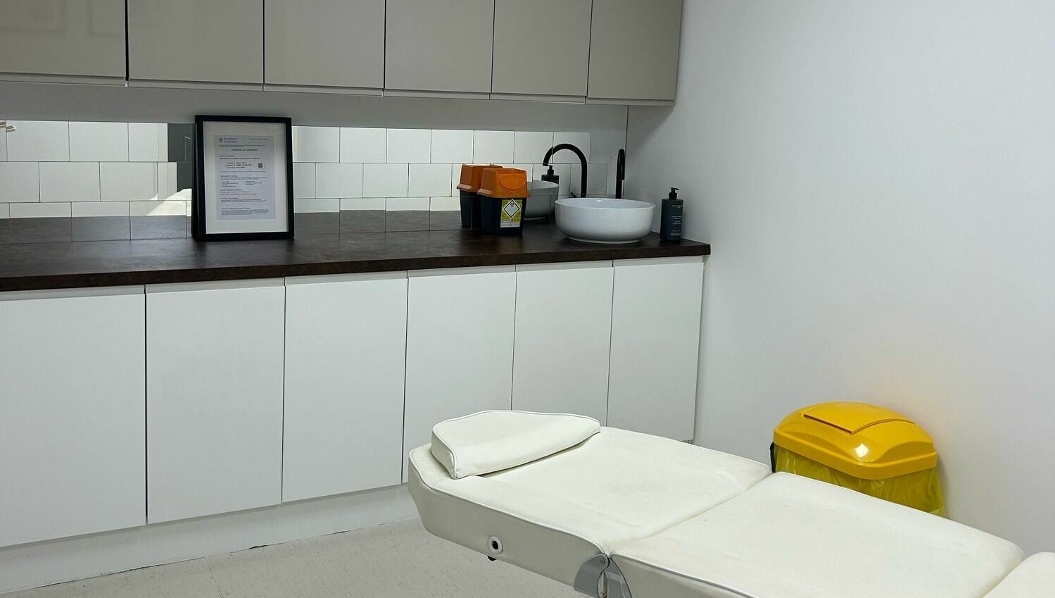 Clean treatment room at RENU By Amber, Bamber Bridge, England, GB, featuring a comfortable white bed and modern decor.