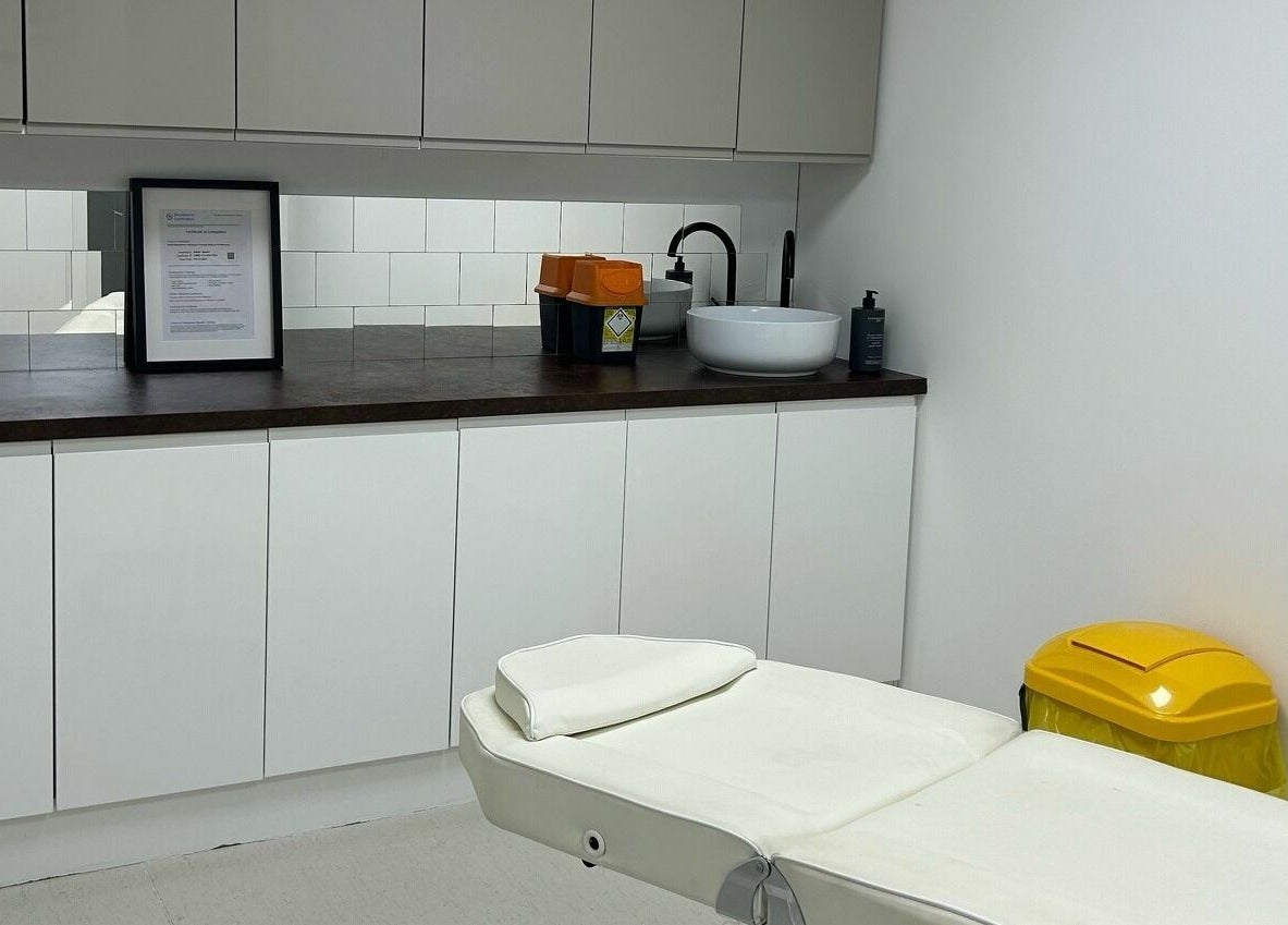 Clean treatment room at RENU By Amber, Bamber Bridge, England, GB, featuring a comfortable white bed and modern decor.