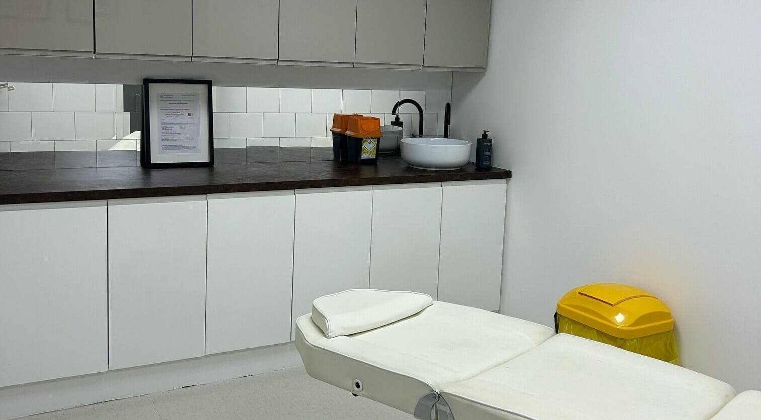 Clean treatment room at RENU By Amber, Bamber Bridge, England, GB, featuring a comfortable white bed and modern decor.