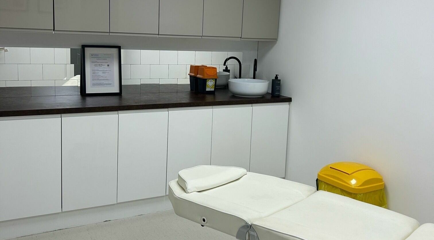 Clean treatment room at RENU By Amber, Bamber Bridge, England, GB, featuring a comfortable white bed and modern decor.