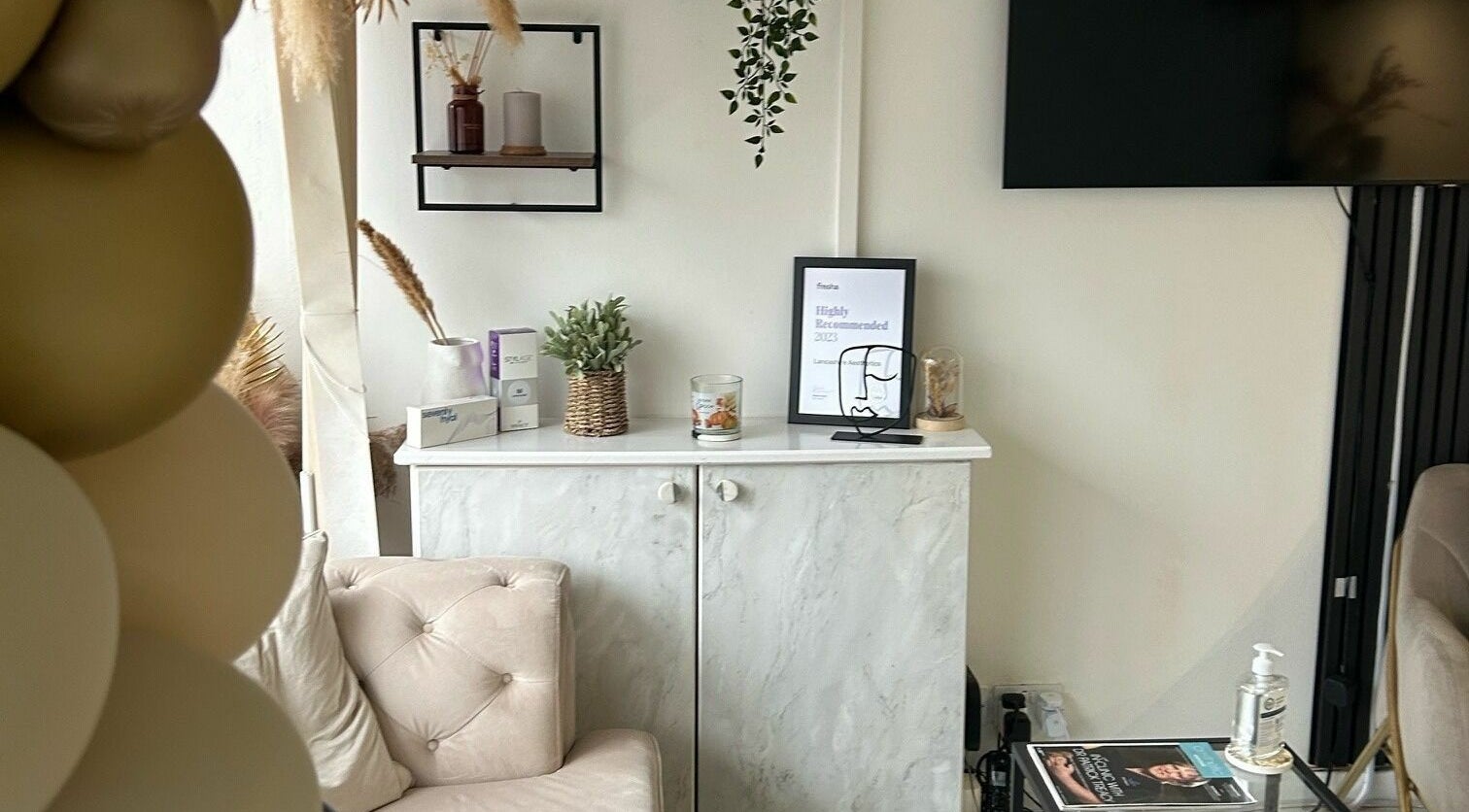 Stylish interior of RENU By Amber in Bamber Bridge, England, featuring elegant decor and a cozy seating area.