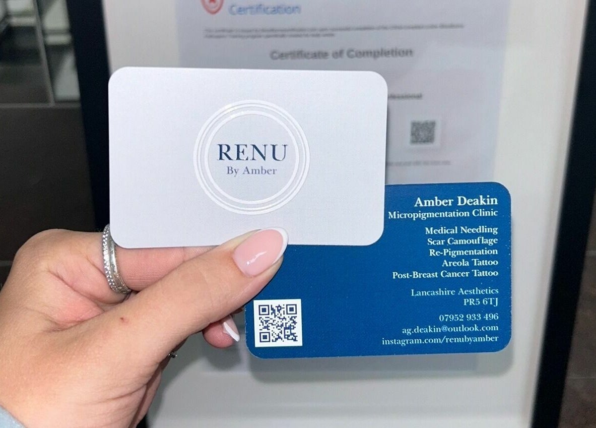 Hand holding RENU By Amber business cards in Bamber Bridge, England, GB, showcasing micropigmentation services.