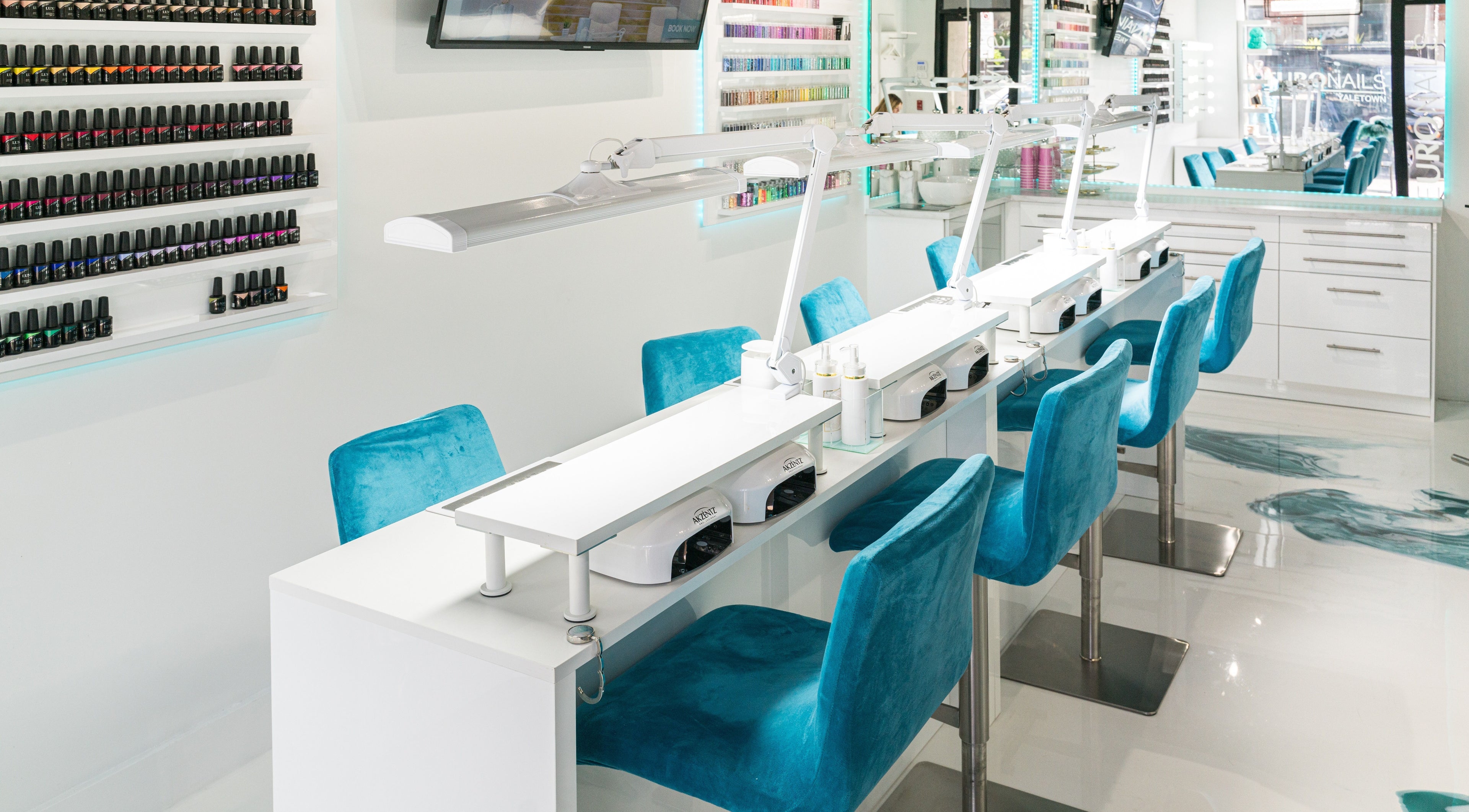 Modern nail bar at Euronails | Vancouver - Yaletown, featuring chic turquoise chairs and polished decor, Vancouver, BC, CA.