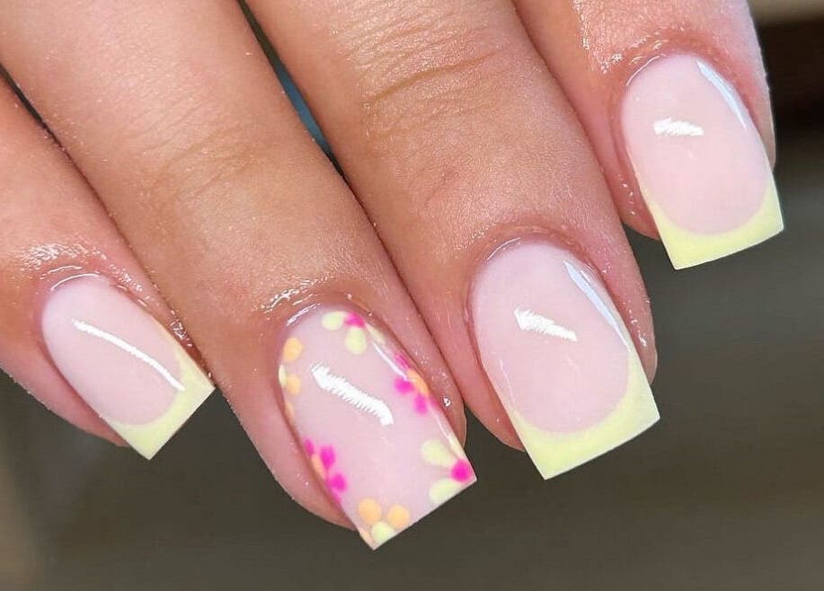 Floral nail art design at Beauty By Hannah, Moorside, England, GB. Elegant pink nails with vibrant flower accents.