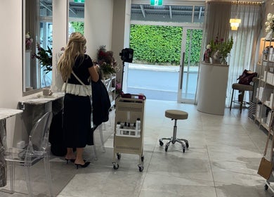 Modern interior of Giovanna Angela Hair salon in Birchgrove, New South Wales, AU. Elegant styling station and products displayed.