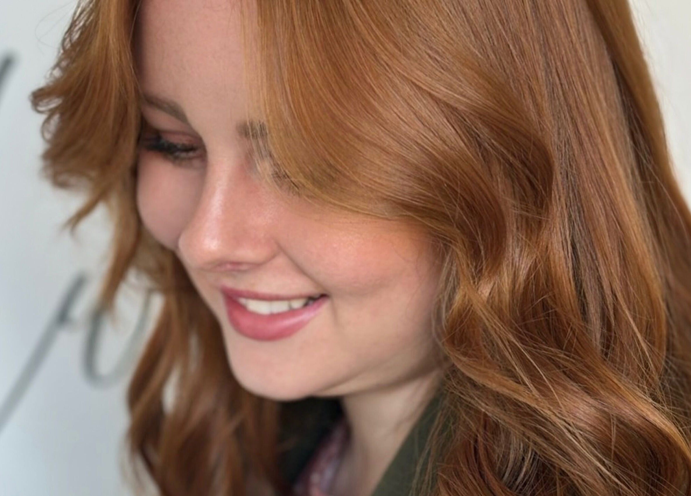 Auburn hair styled at Rum and Ruby Hair Design, Hermanus, Western Cape, ZA, highlighting rich color and texture.