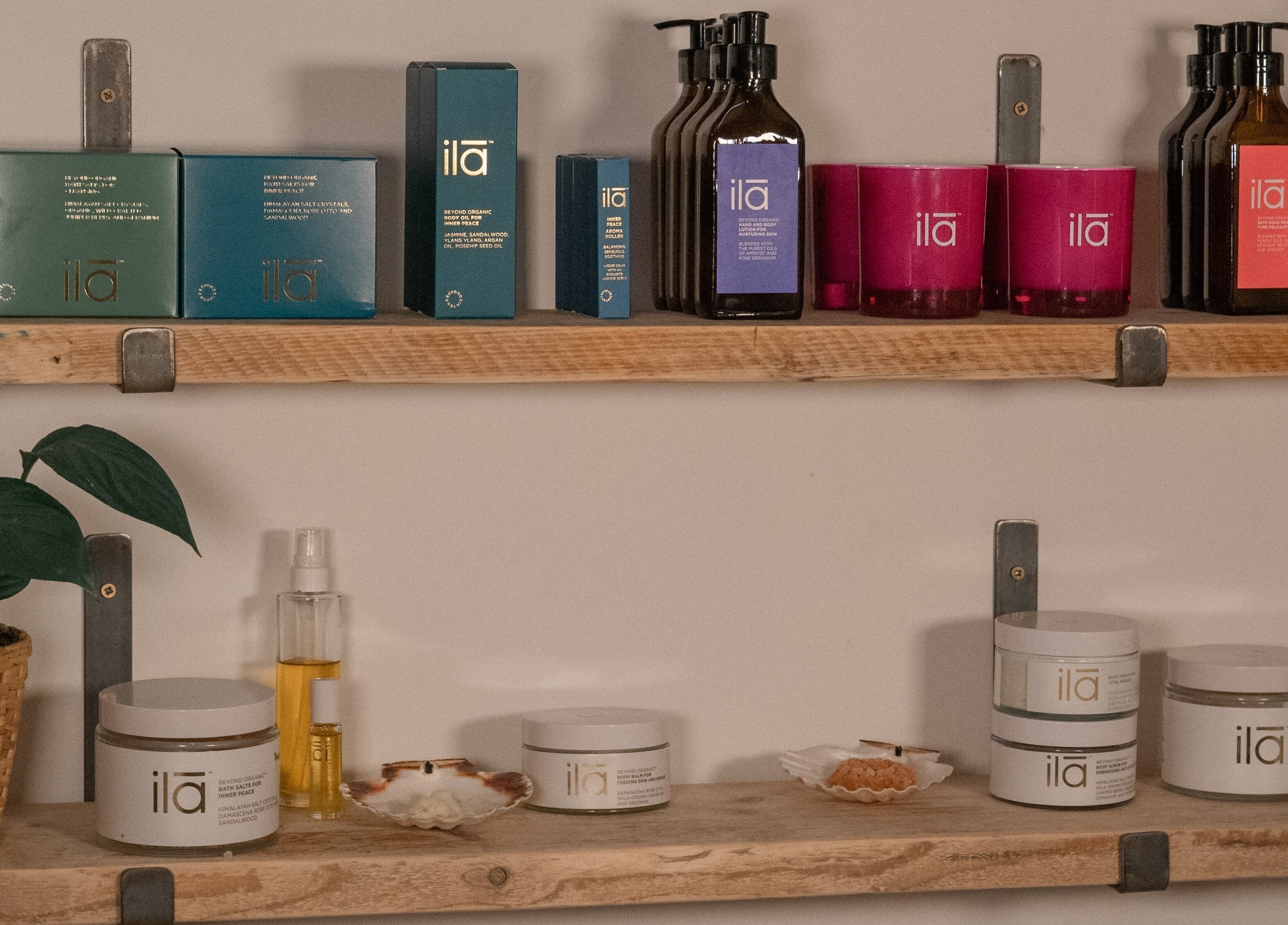 Spa Studio by Lost Shore in Newbridge displays beauty products on wooden shelves for relaxation.