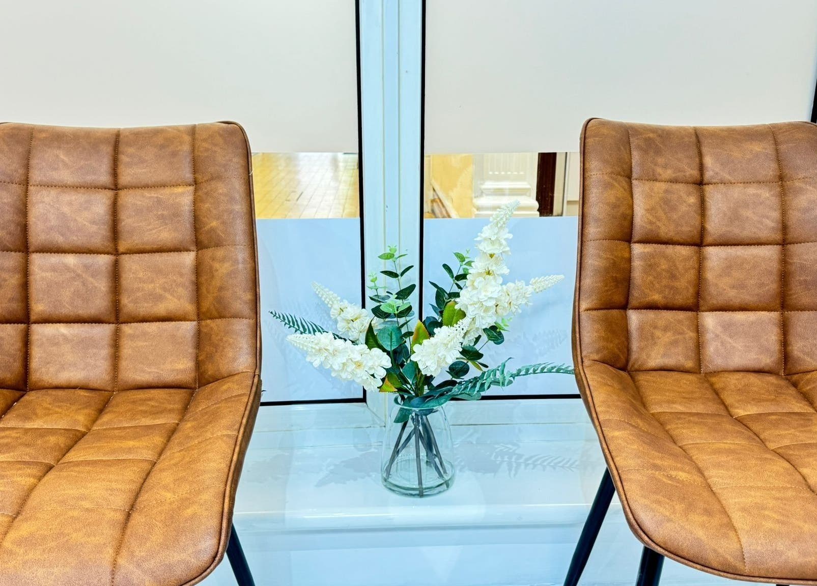 Elegant leather chairs with floral decor at BN Beauty - Rottingdean, Brighton And Hove, England, GB.