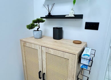 Stylish wooden cabinet with decor at BN Beauty - Rottingdean, Brighton And Hove, England, GB.