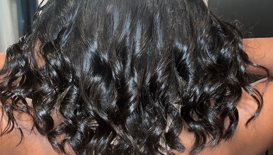 Luxurious dark curls styled at Blowout Boulevard, New York, New York, US.
